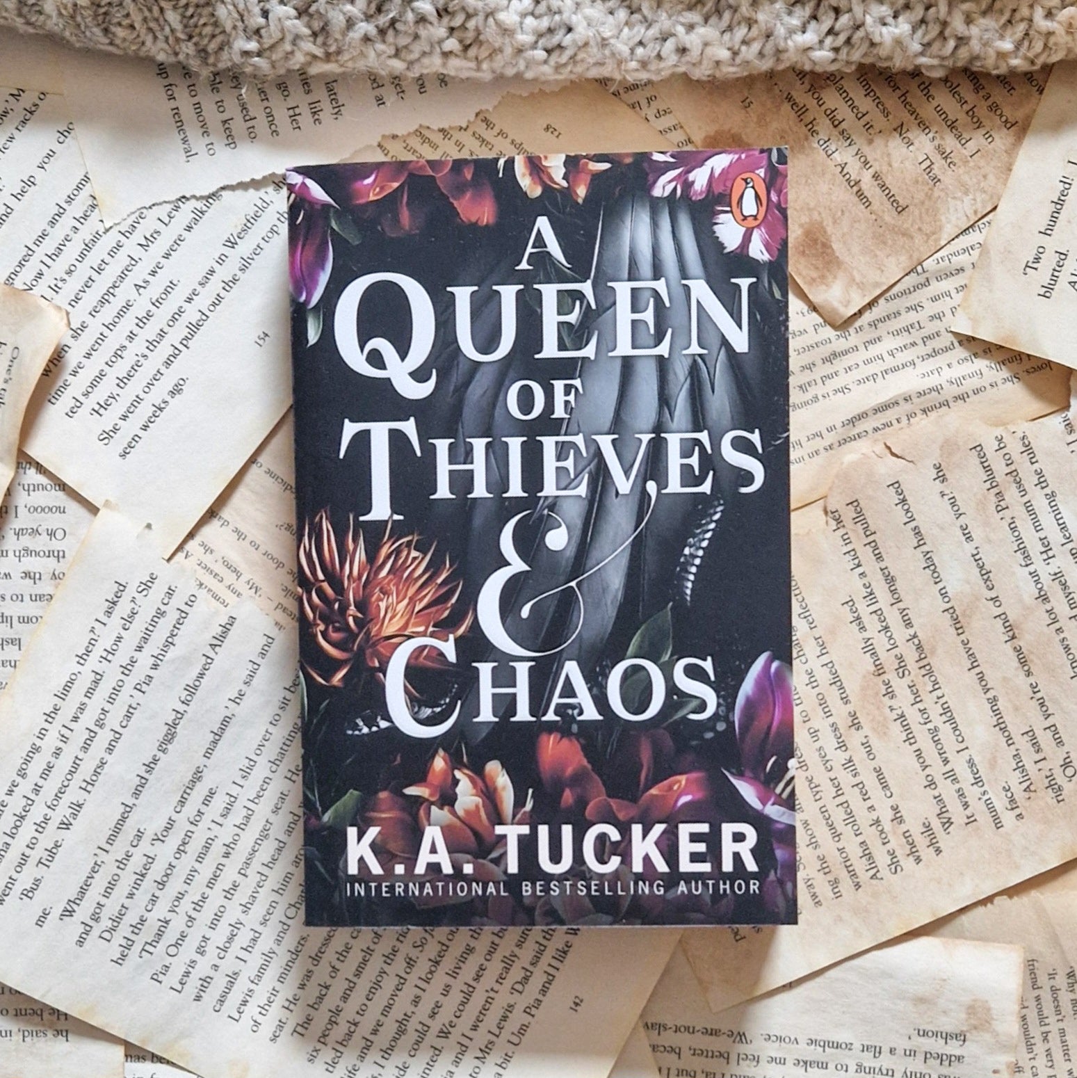 A queen of theives and choas paperback by K.A Tucker. 
