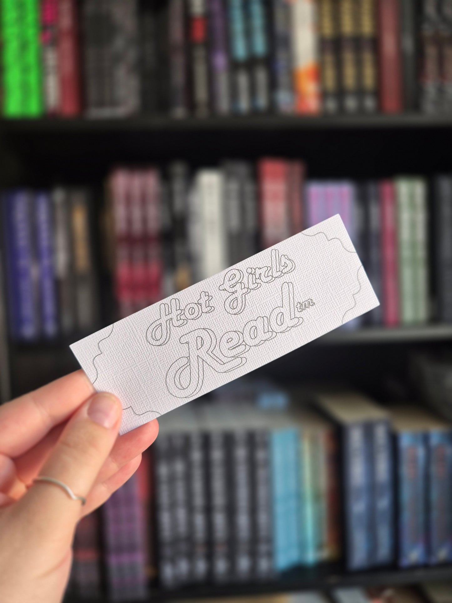 Colour your own bookmark with the phrase 'hot girls read tm' 